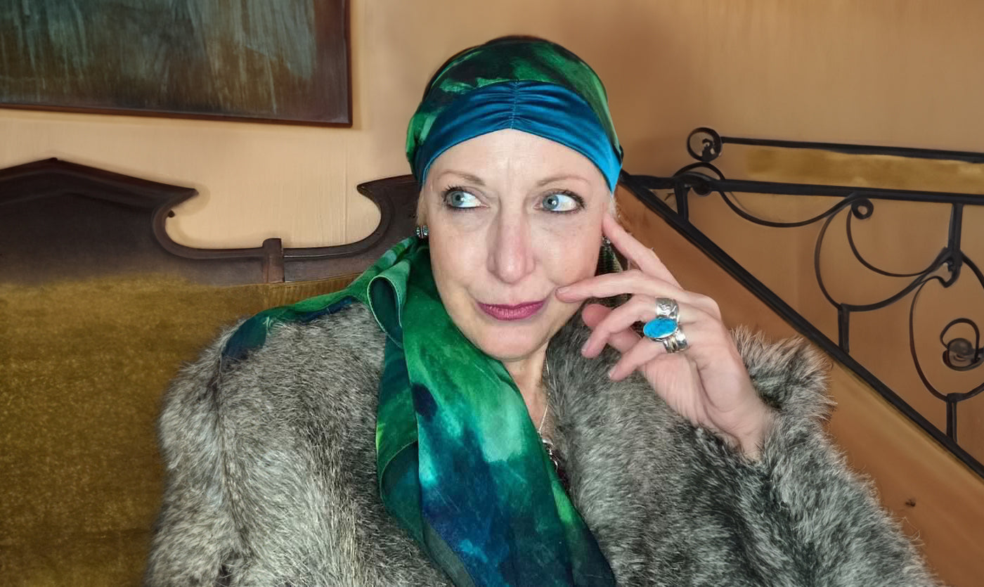 Bohemian inspired artist portrait of woman in brightly colored peacock tone headscarf