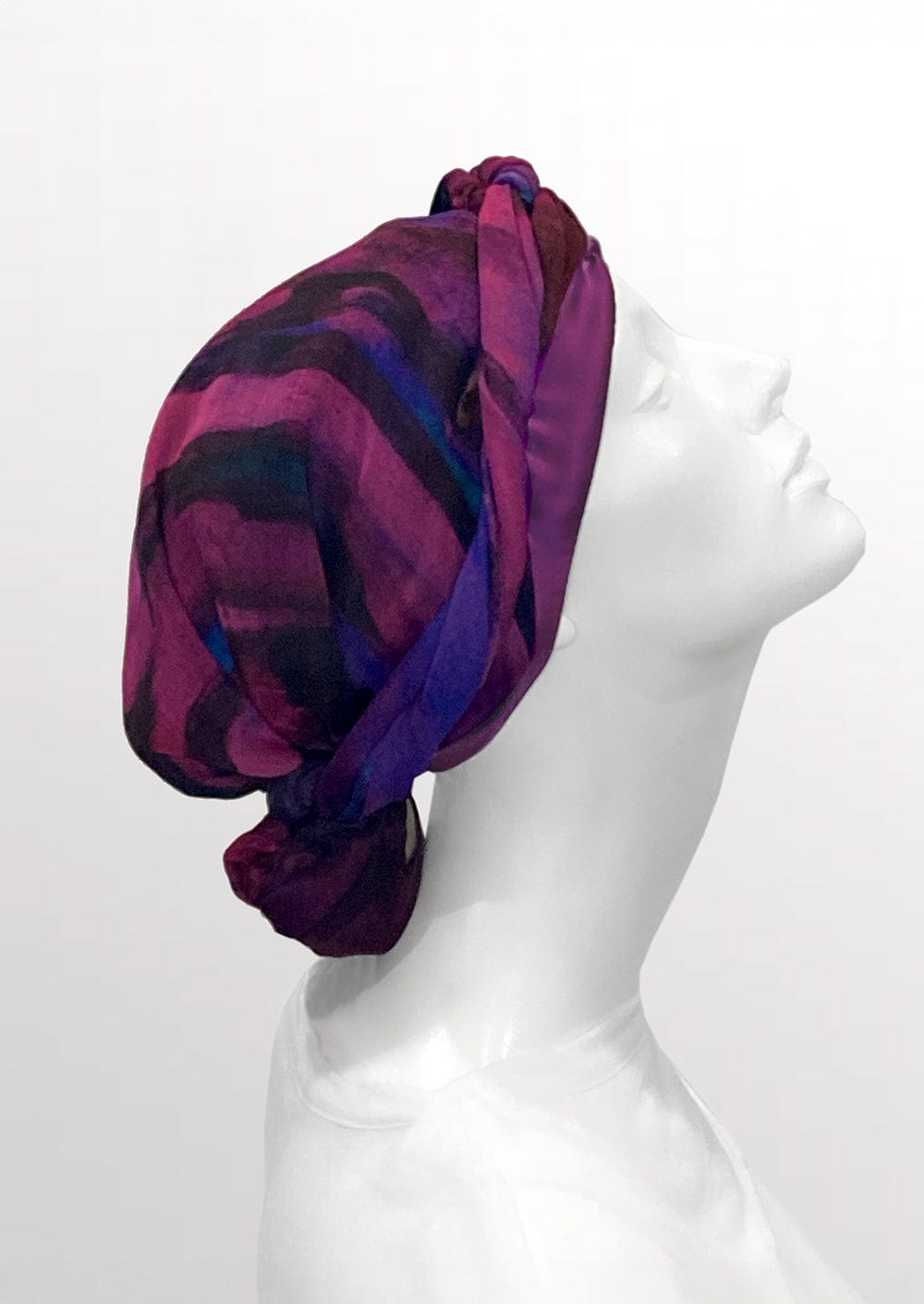 Fashionable woman in medically accessible adaptive clothing head scarf.