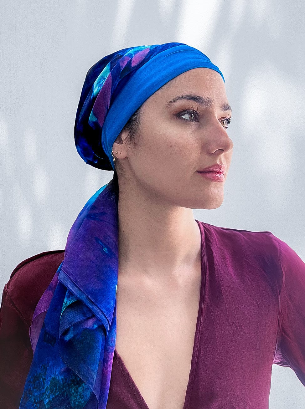 Woman in beautiful sapphire blue silk headscarf