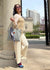 Fashionable woman in medically accessible adaptive clothing.