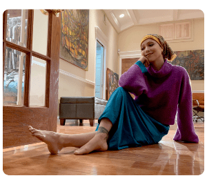Paloma Soledad interview with the Melanoma Research Alliance , about her rare melanoma journey with Acral melanoma she is sitting in her living room  in her LuxCare Clothing