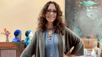 Paloma soledad the winner of Venmo small business grant ,  in her sewing design studio