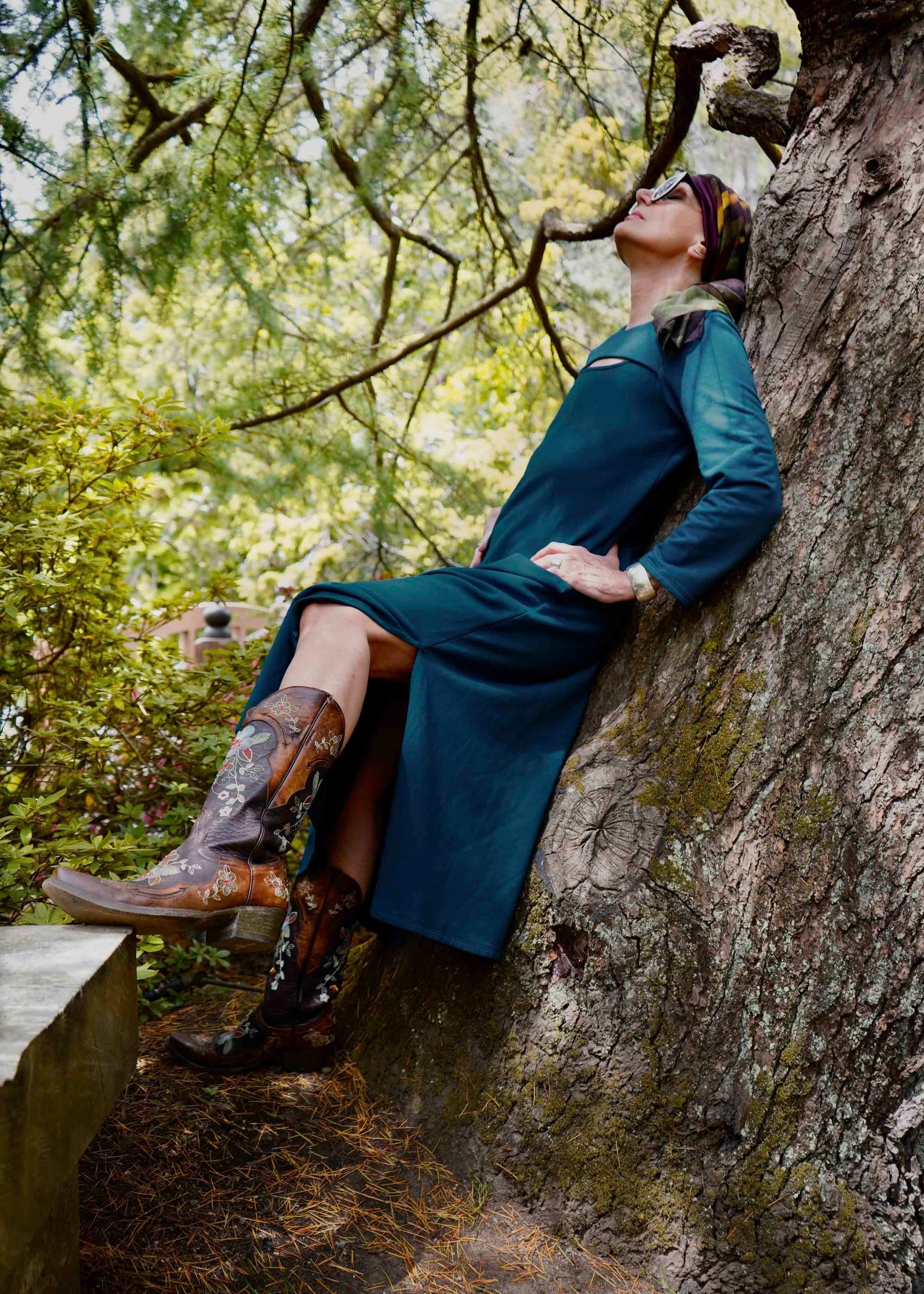 Woman is a cozy stylish dress that is chest port accessible for infusions. 