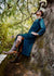 Woman is a cozy stylish dress that is chest port accessible for infusions. 