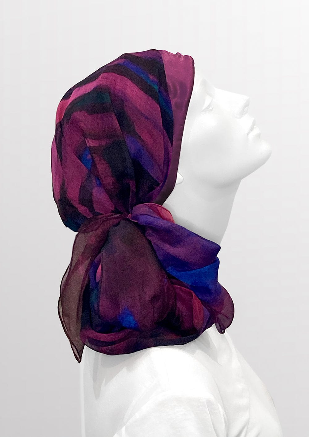 Fashionable woman in medically accessible adaptive clothing head scarf.