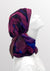 Fashionable woman in medically accessible adaptive clothing head scarf.