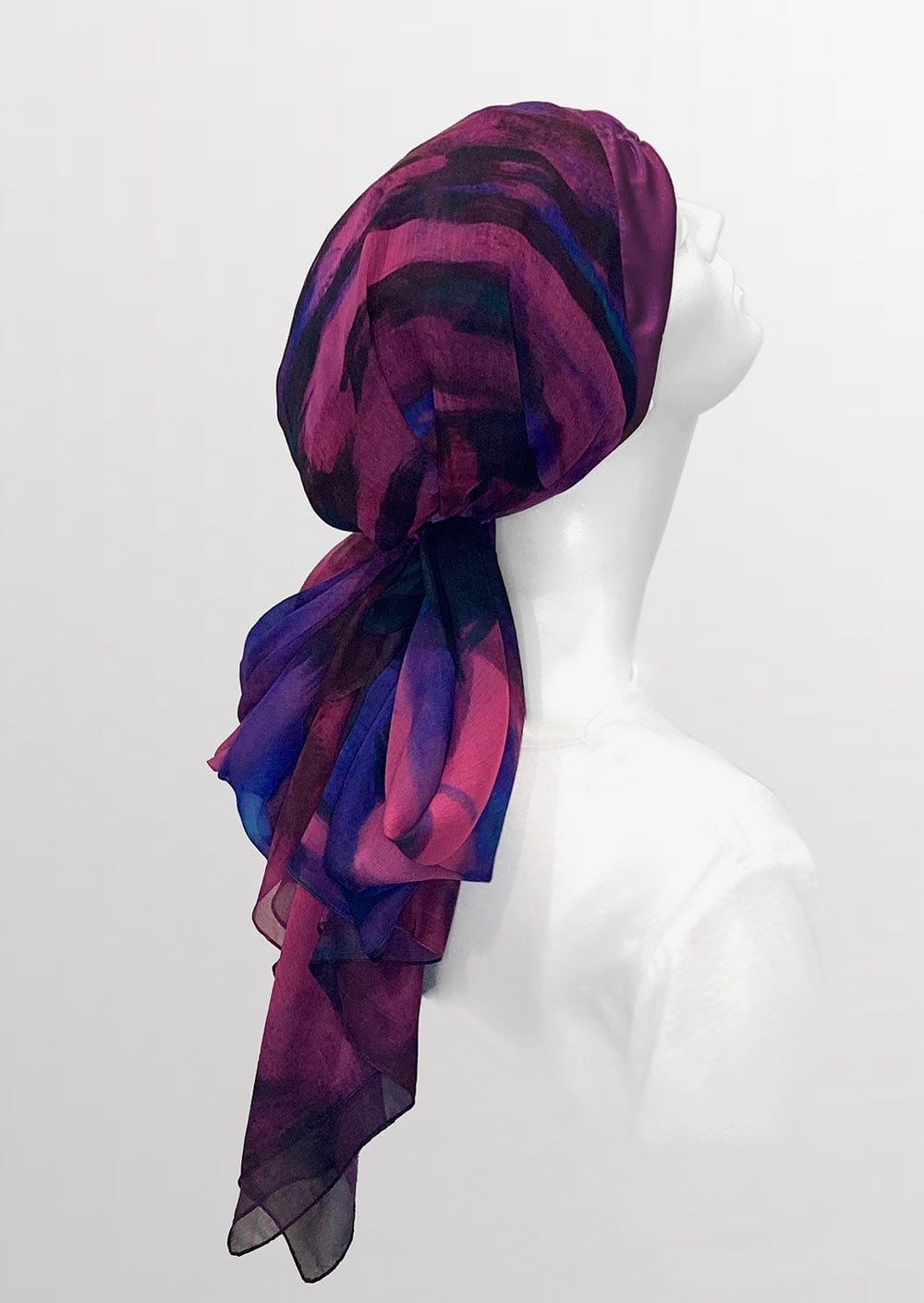 side veiw Fashionable  medically accessible adaptive clothing head scarf, perfect gift for those experiencing hair loss from cancer treatments. Silk and custom artwork printed on Chiffon in a berry color 