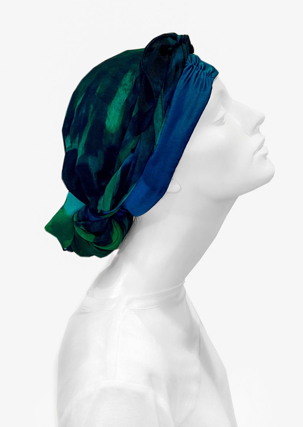 Fashionable woman in medically accessible adaptive clothing head scarf.
