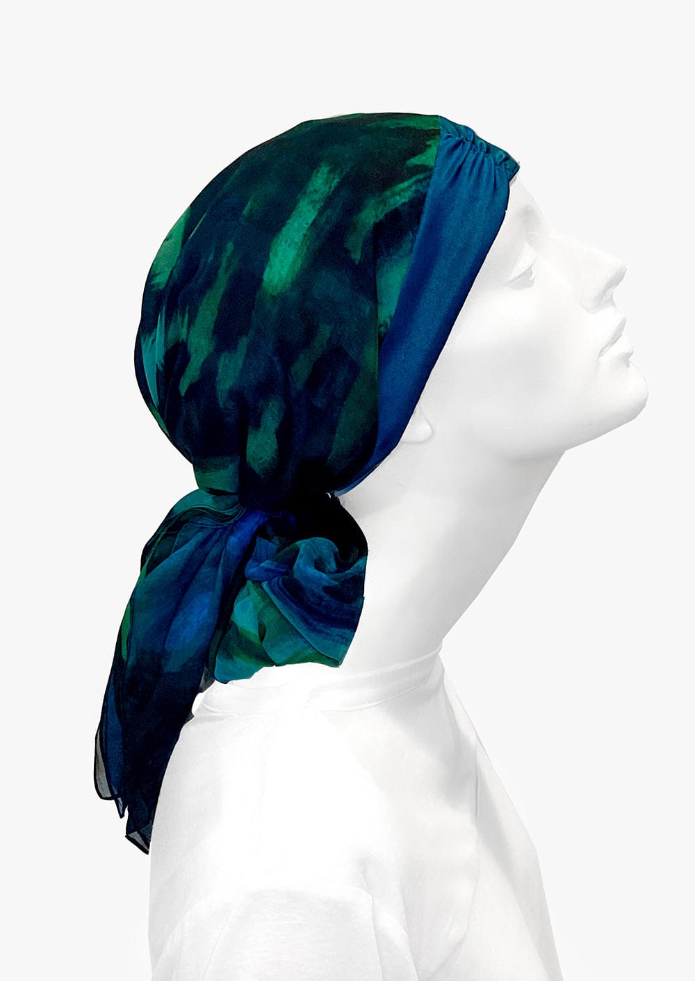 Fashionable woman in medically accessible adaptive clothing head scarf.