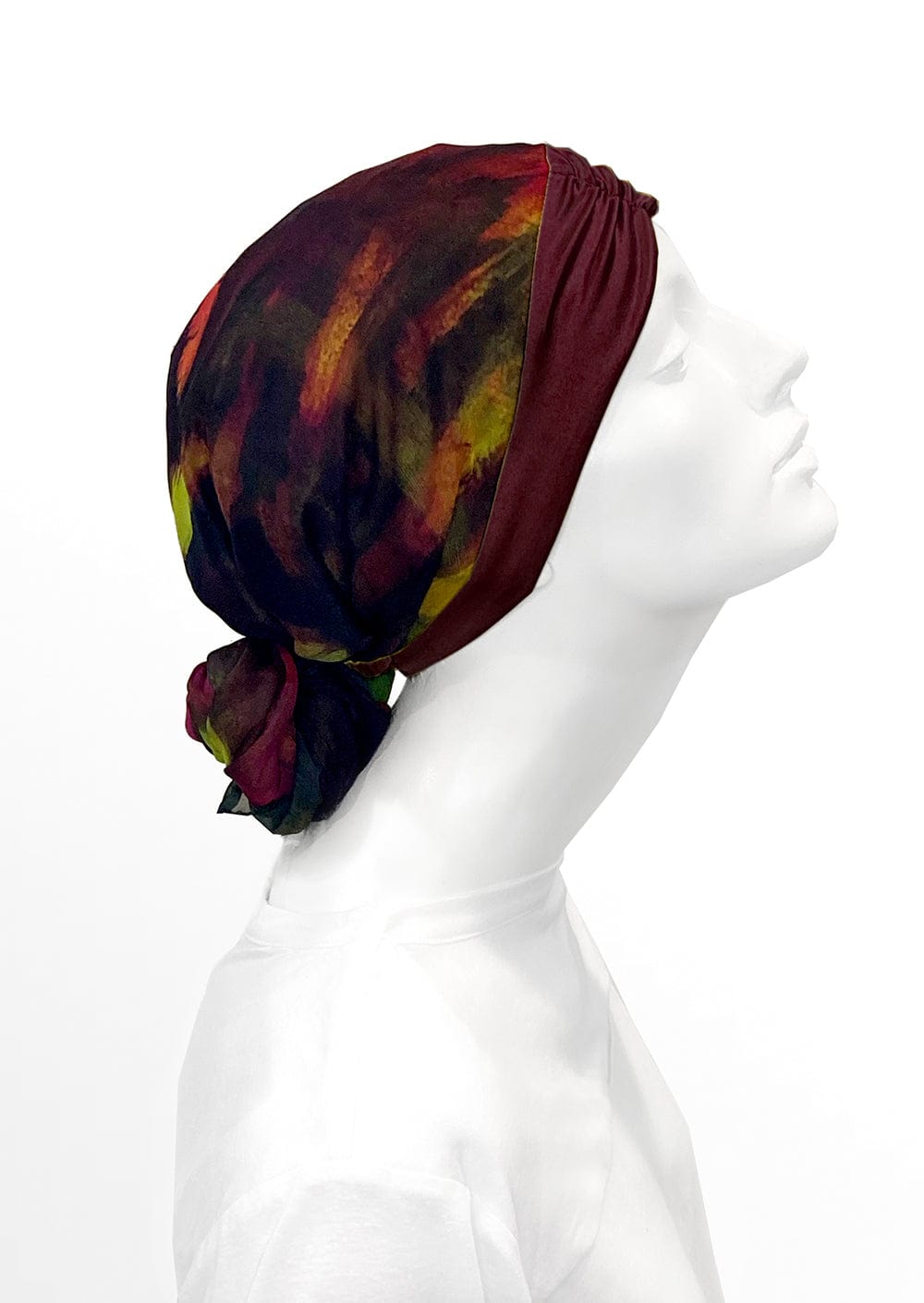 Fashionable woman in medically accessible adaptive clothing head scarf.