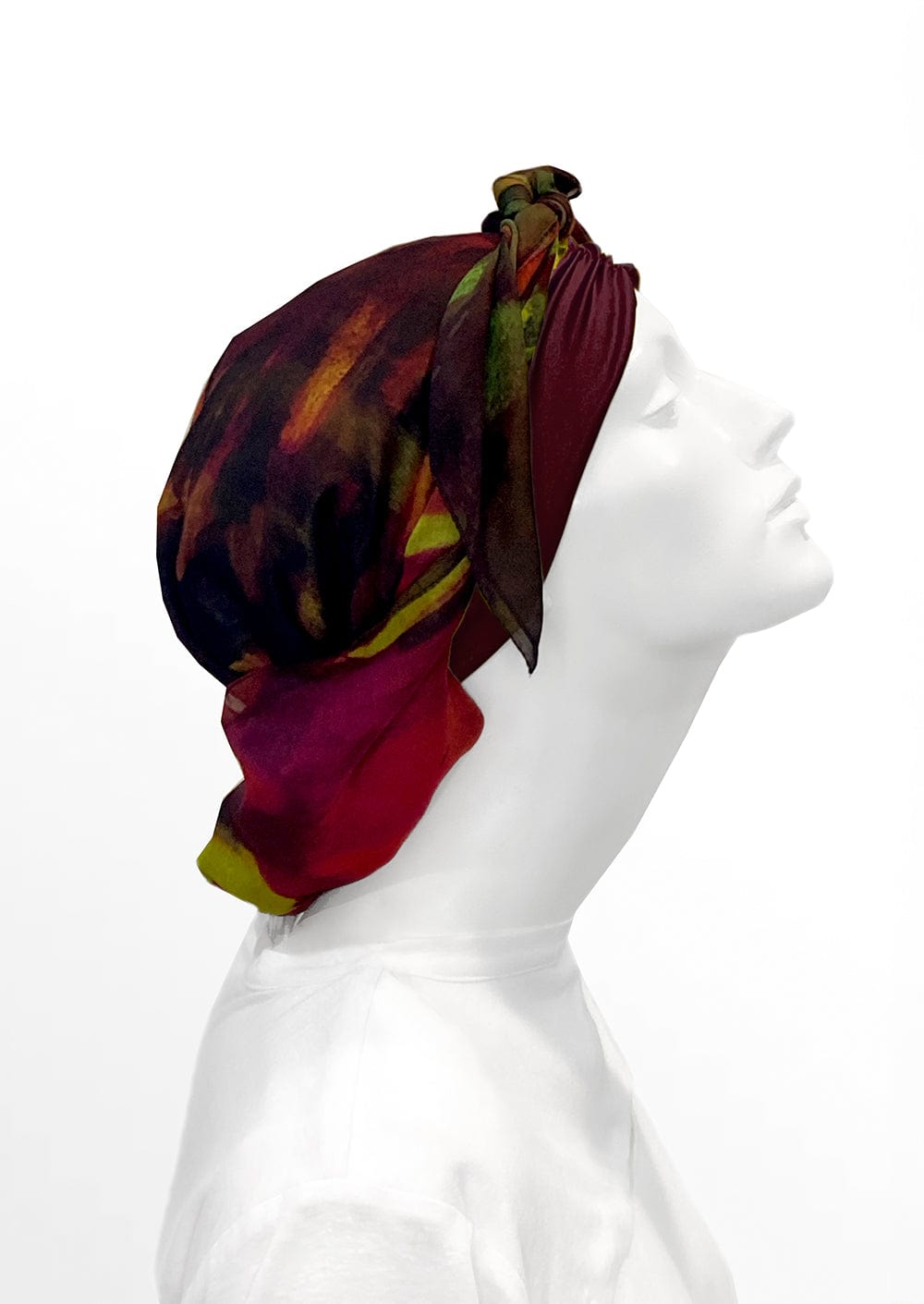 Fashionable woman in medically accessible adaptive clothing head scarf.