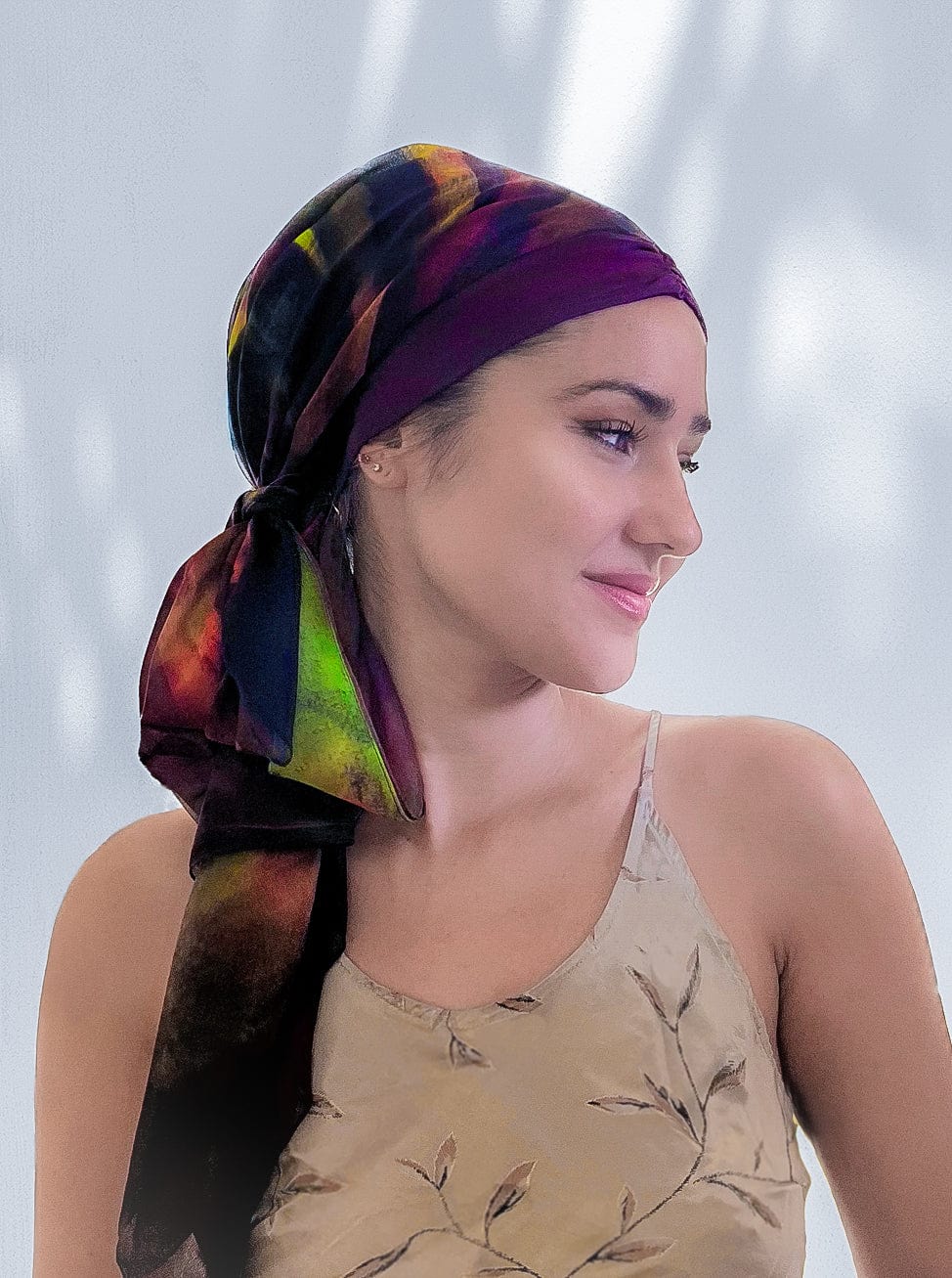 Fashionable woman in medically accessible adaptive clothing head scarf.