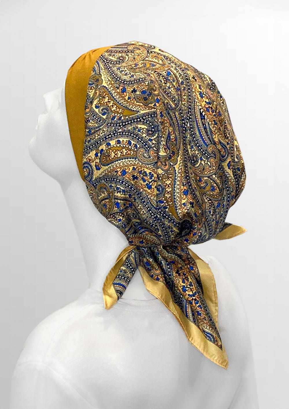 tied side view head covering for cancer patients 
headscarf for hair loss, golden and blue with paisley   