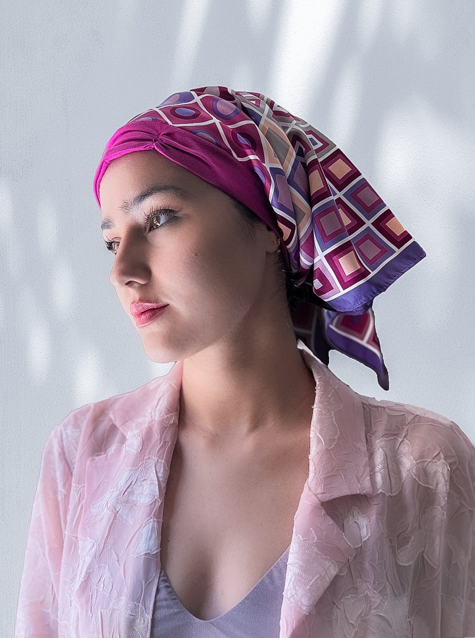 Fashionable woman in medically accessible adaptive clothing head scarf.