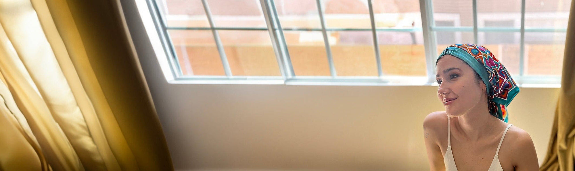 woman in a beautiful head scarf for cancer treatments